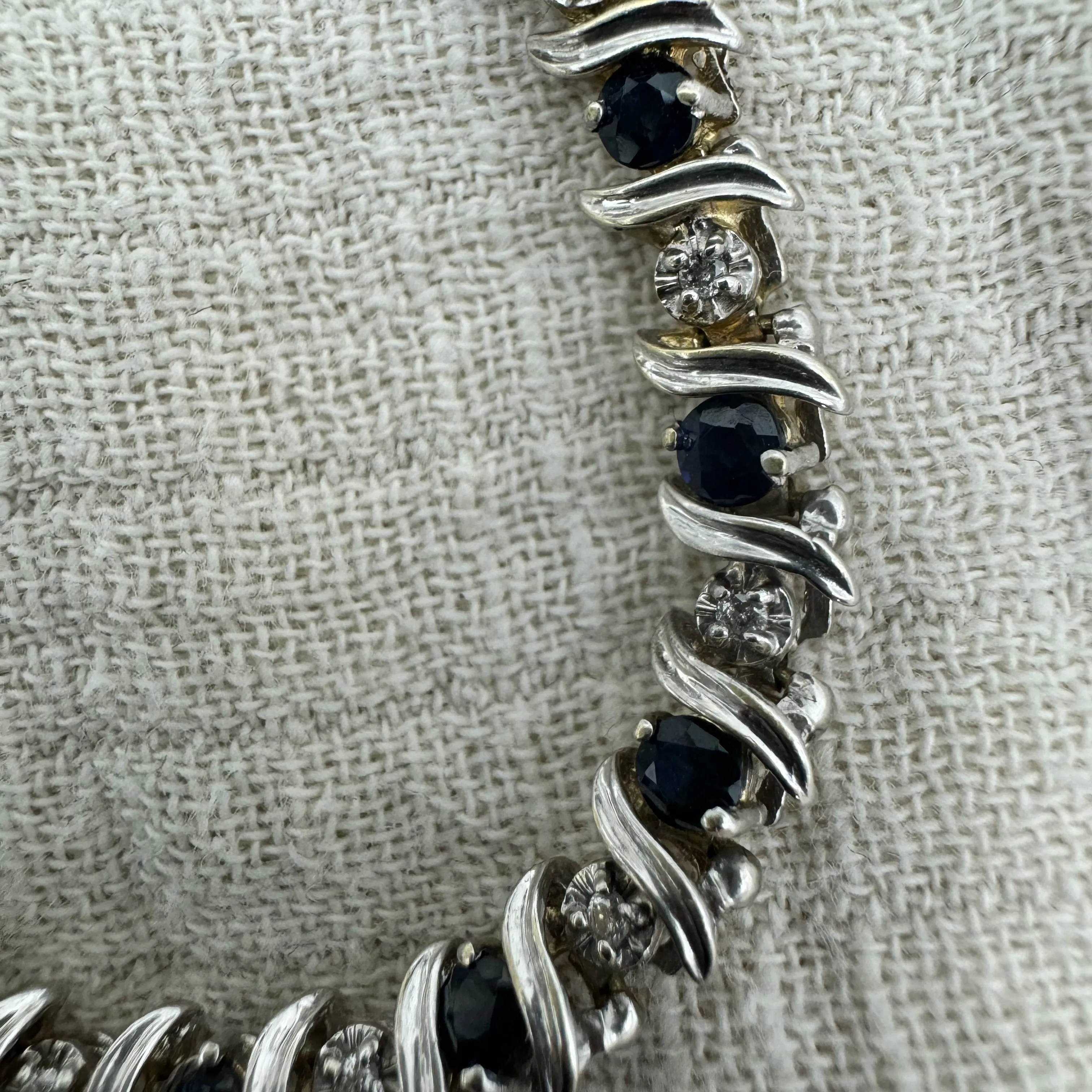 14K gold bracelet set with alternating deep blue Sapphires and sparkling Diamonds