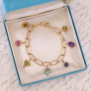 14k Gold Charm Bracelet with 7 Antique Charms