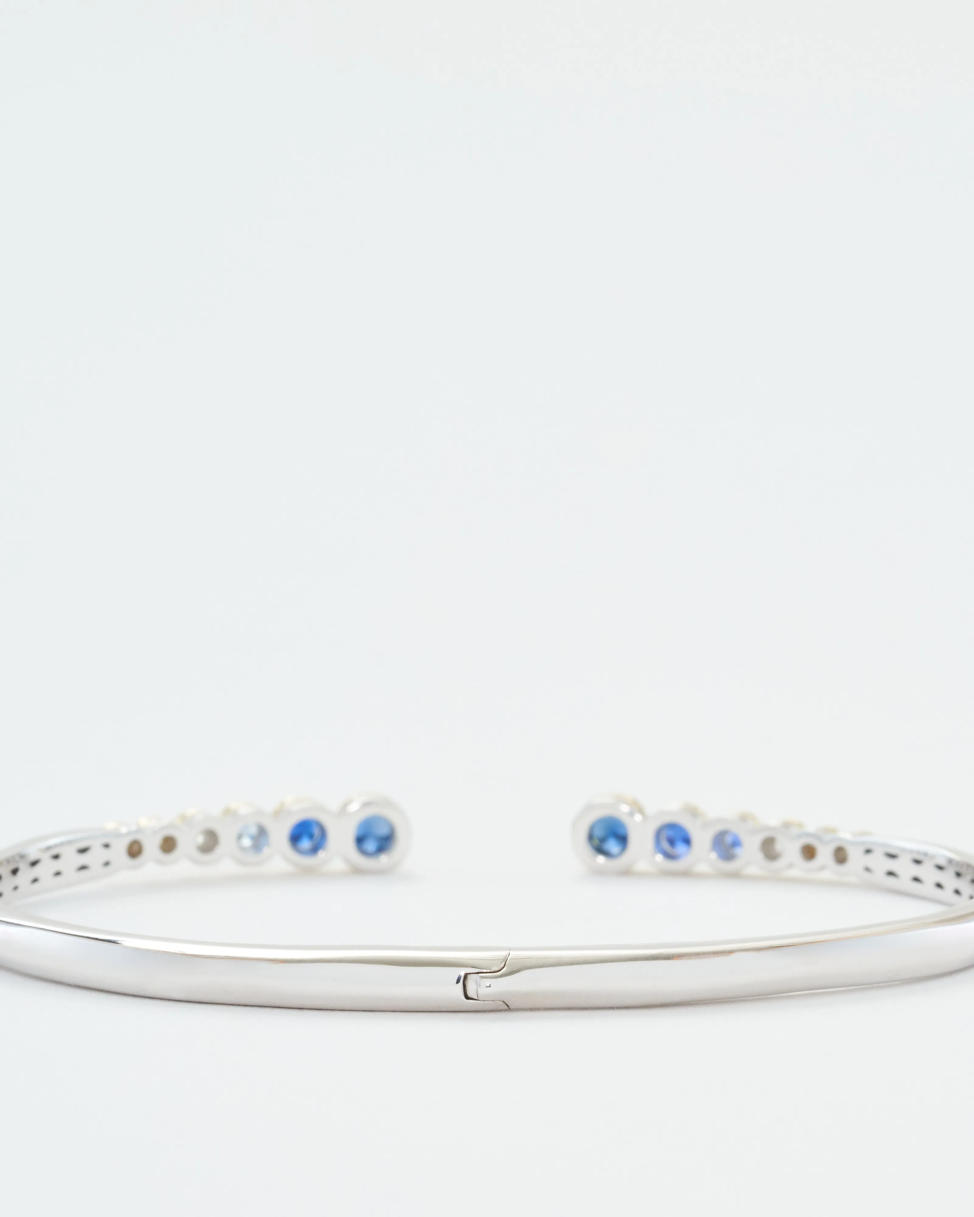 classic two-toned open bezel set sapphire bangle