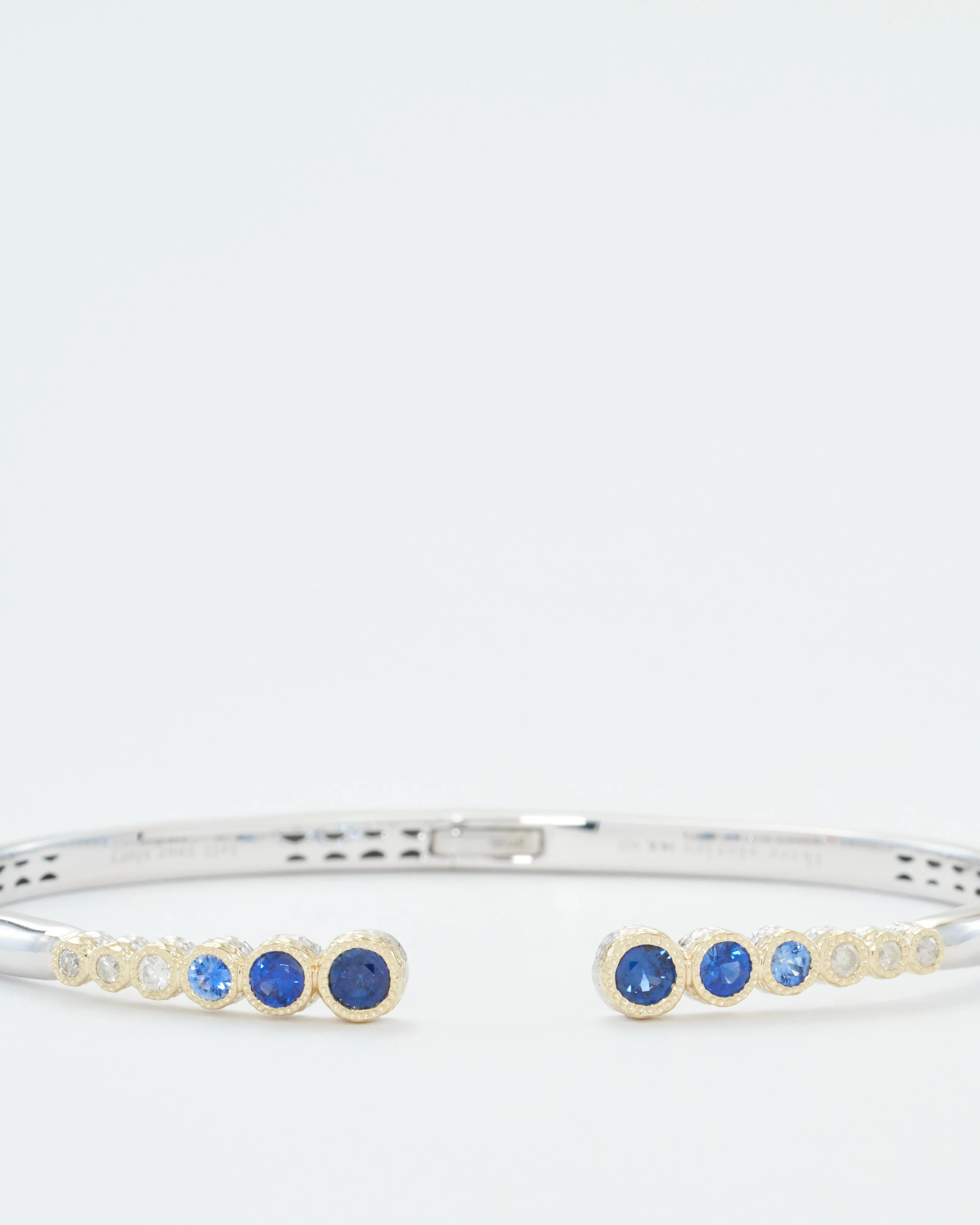 classic two-toned open bezel set sapphire bangle