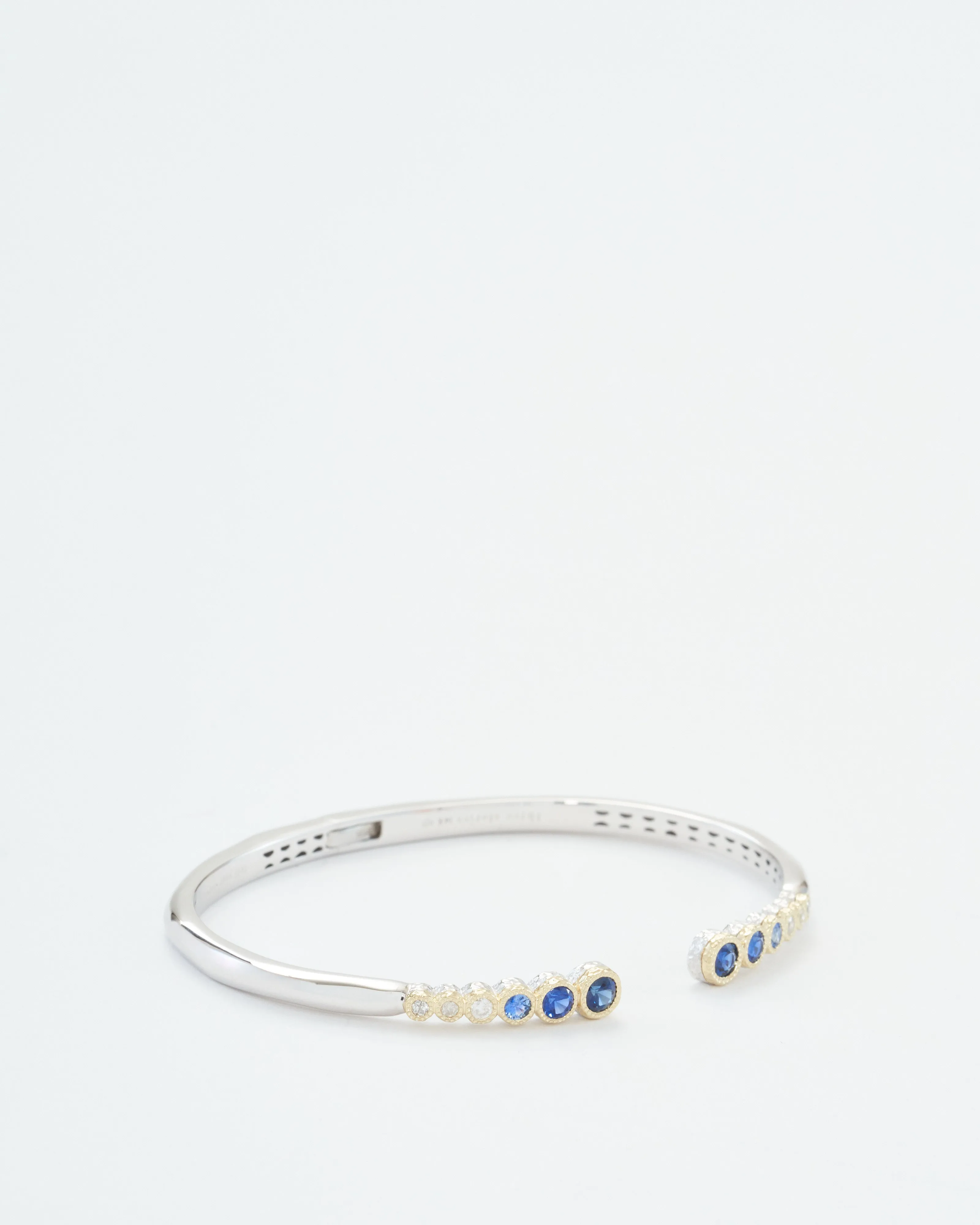 classic two-toned open bezel set sapphire bangle