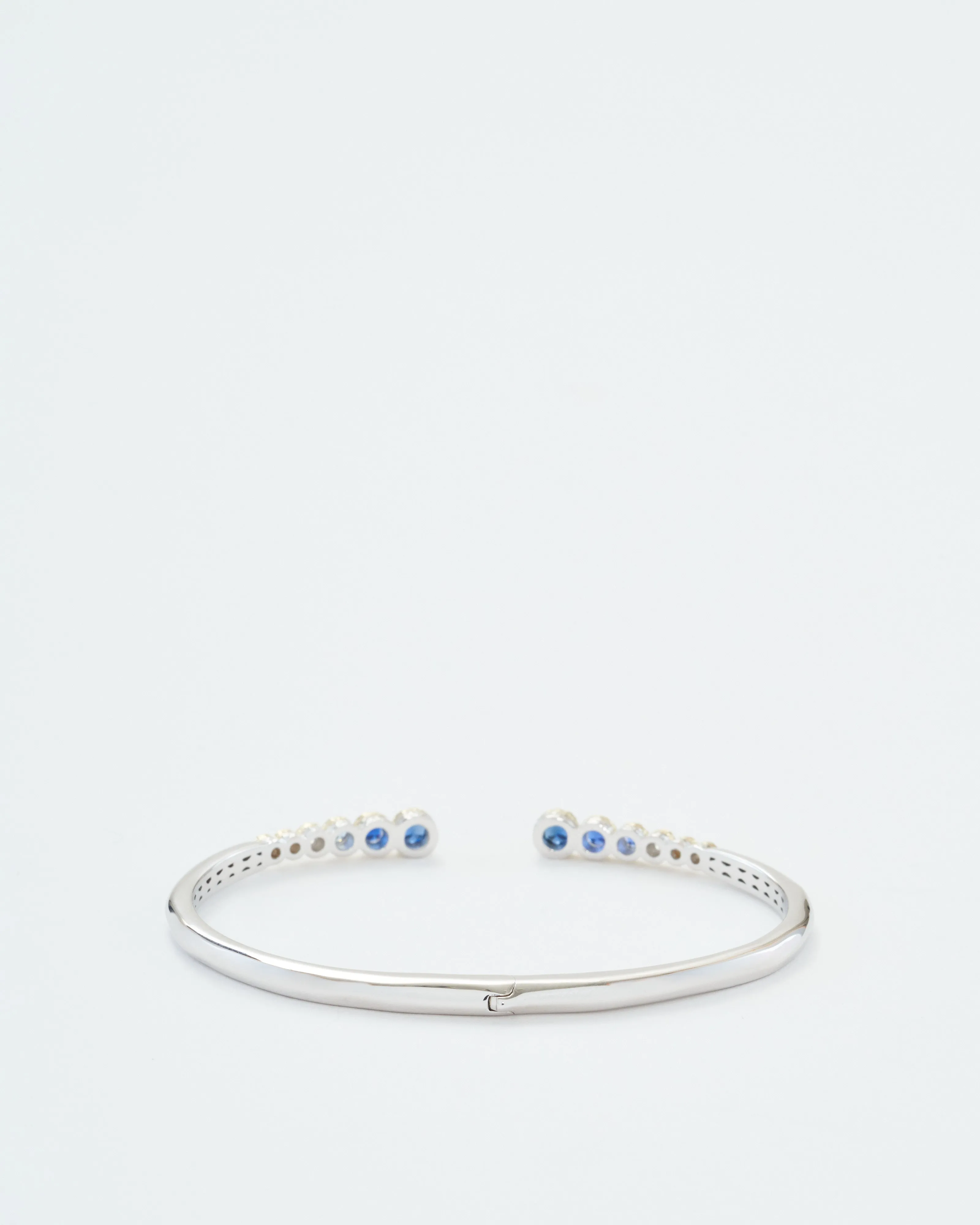 classic two-toned open bezel set sapphire bangle