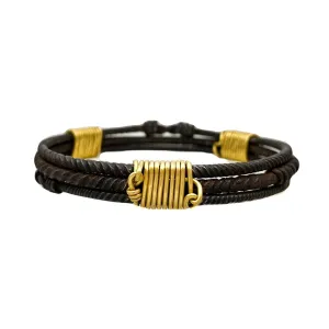 Three old African wrought iron "money" bracelets lashed together with 22K gold wires
